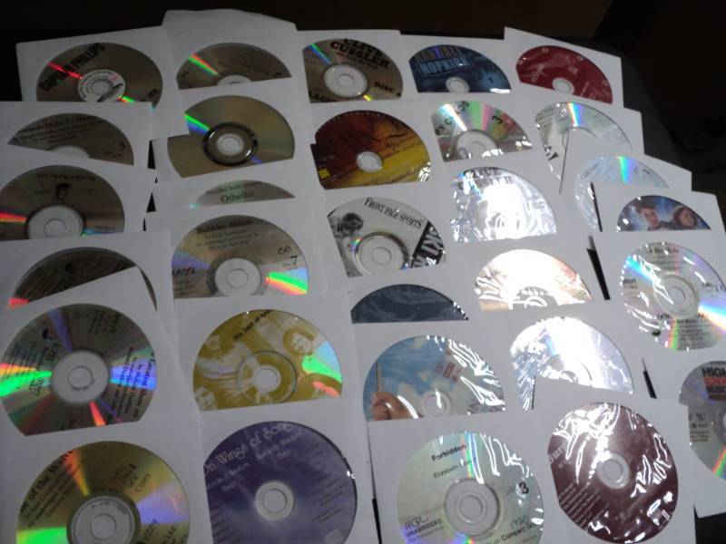 lot 152 image: 100 CDs and DVDs and Games...