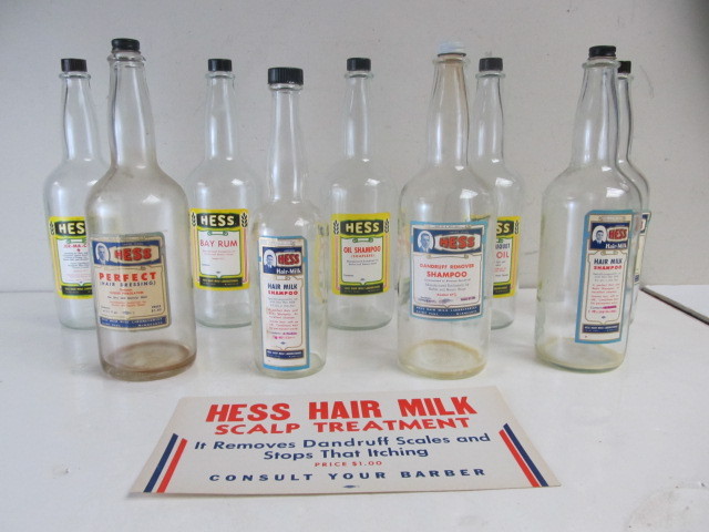 lot 176 image: Original Old Vintage HESS HAIR MILK BarberSalon Bottles wCardboard Advertising Sign