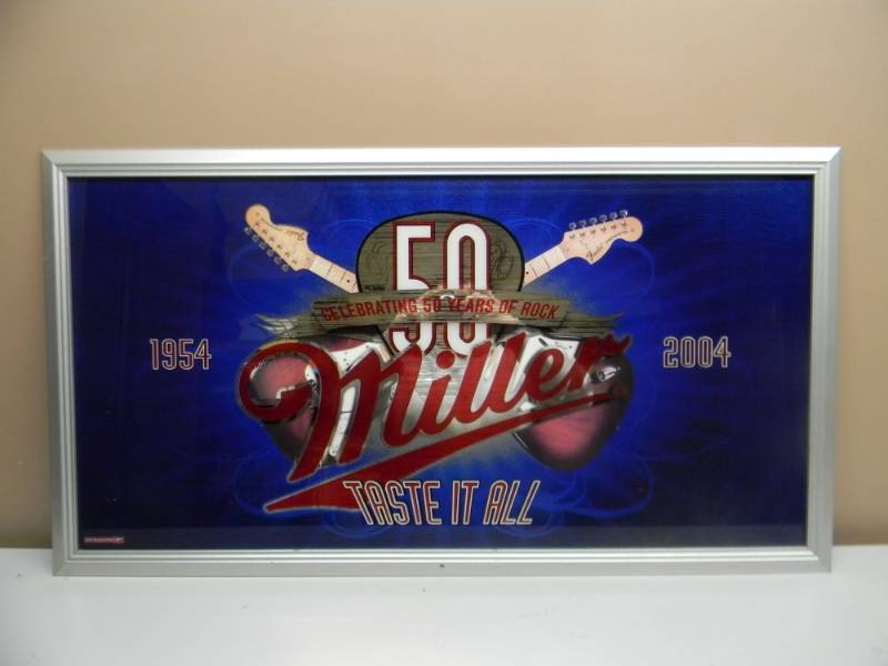 lot 11 image: MILLER CELEBRATING 50 YEARS OF ROCK, TASTE IT ALL - 1954-2004 - BAR SIGNMIRROR AWESOME PIECE- APPROX 40 BY 22 - SEE PICTURES