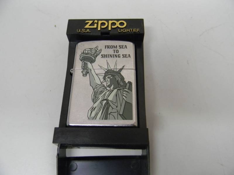 lot 24 image: NOS NEVER USED ZIPPO LIGHTER - FROM SEA TO SHINING SEA - SEE PICTURES