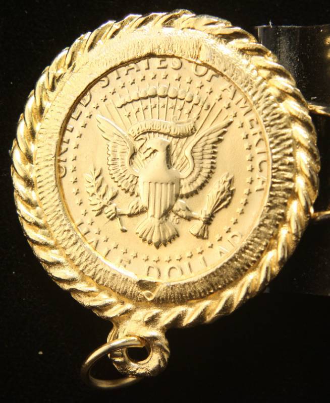 lot 16 image: GOLD PLATED 1971-D KENNEDY HALF IN BEZEL