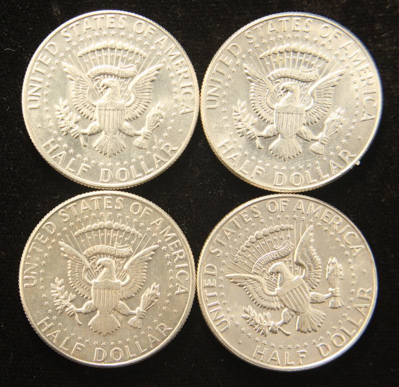 lot 57 image: 4 AU-UNC 40% SILVER KENNEDY HALF DOLLARS