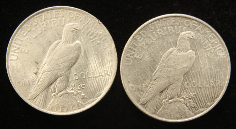 lot 73 image: 2 HIGHER GRADE 1922 PEACE SILVER DOLLARS