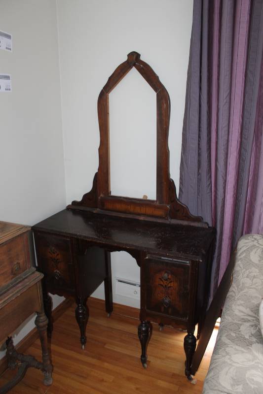 lot 12 image: Rolling Wood 4-Drawer Dresser with Wood Framed Vanity Mirror
