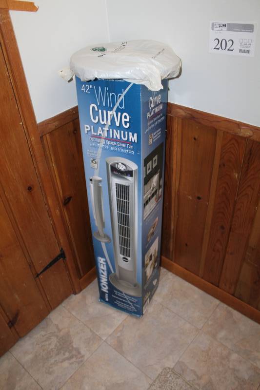 lot 202 image: Lasko 42in. Wind Curve Platinum Oscillating Space-Saver Fan with Fresh Air Ionizer