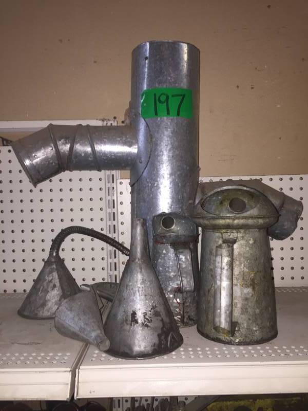 lot 197 image: Four Old Vintage Oil Cans, Funnel & Tin Man