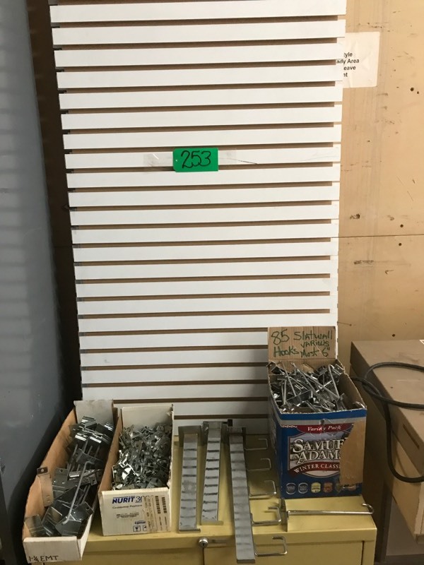lot 253 image: Four pcs Slatwall 29Wx52H, Three boxes various slatwall hooks