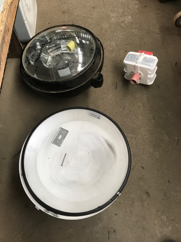 lot 311 image: Two Large Light Fixtures, One New Lithonia White 400W Type M135ml 120208240277, One Black Moldcast US Lighting 175W