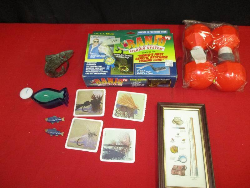 lot 26 image: Fishing picture, Water Markers, Banjo Fishing System,  Metal fish candle holder, Candle