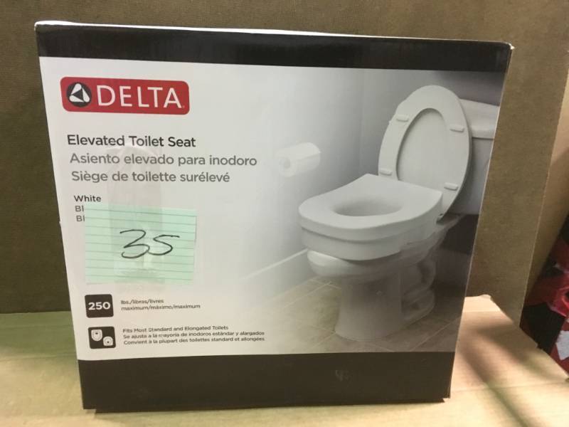 lot 35 image: Delta Elevated Toilet Seat in White  in like new condition