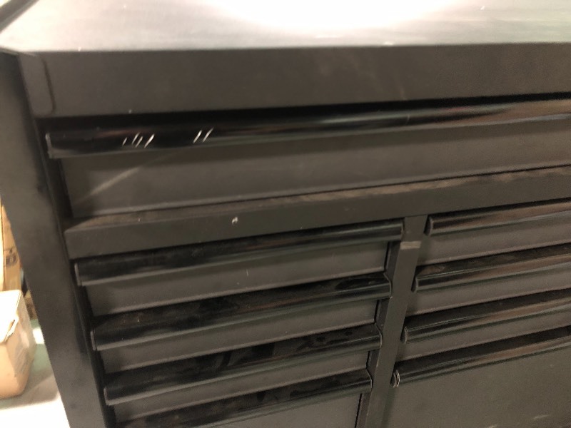 lot 102 image: Husky Industrial 52 in. 9-Drawer  Cabinet Tool Chest in Textured Black used in working conditions whit scratches and door need help to close in open