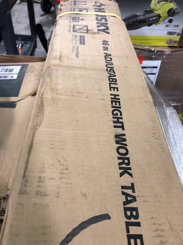 Husky 46 in. Adjustable Height Work Table not used