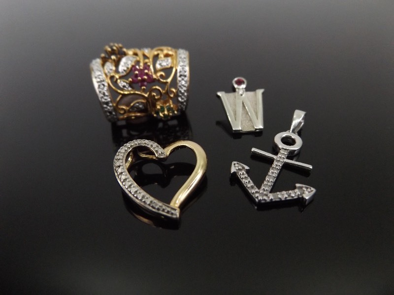 lot 52 image: 4 Diamond Accented .925 Sterling Silver Pendants