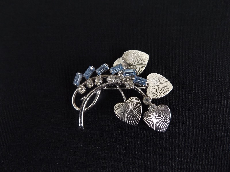 lot 73 image: .925 Sterling Silver Blue Topaz Baguette and Crystal Flower Brooch