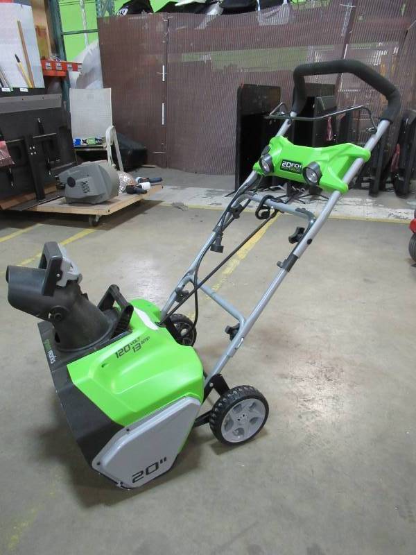 lot 22 image: Greenworks 20 in. 13 Amp Electric Snow Blower with Lights, GW2600202 - Power Switch Is Broken.