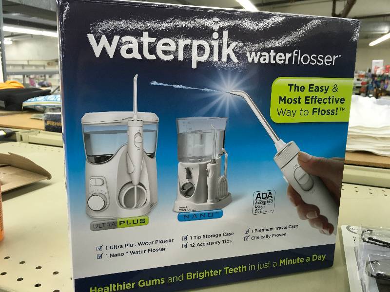lot 317 image: Waterpik Water Flosser, Retail $79.99