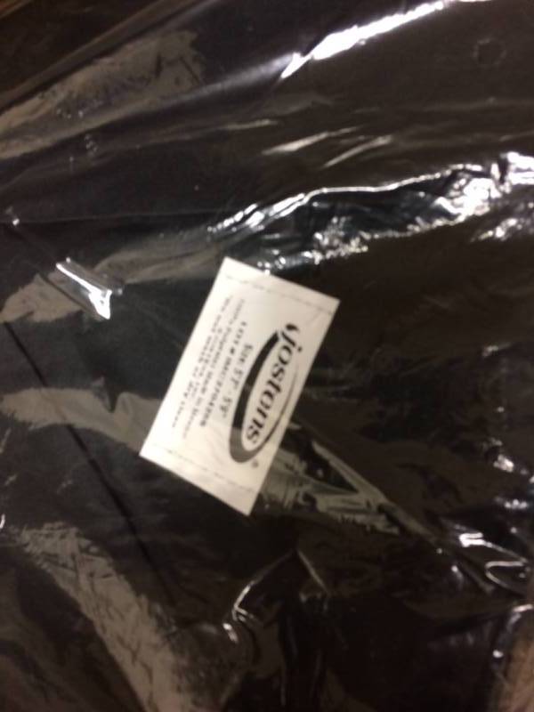 lot 128 image: Large Lot Of New Jostens Black Graduation Gowns - Variety Of Sizes Bachelor & Associate Degree Gowns Each Packaged Includes Cap -  Couple Doctorate Gowns Included