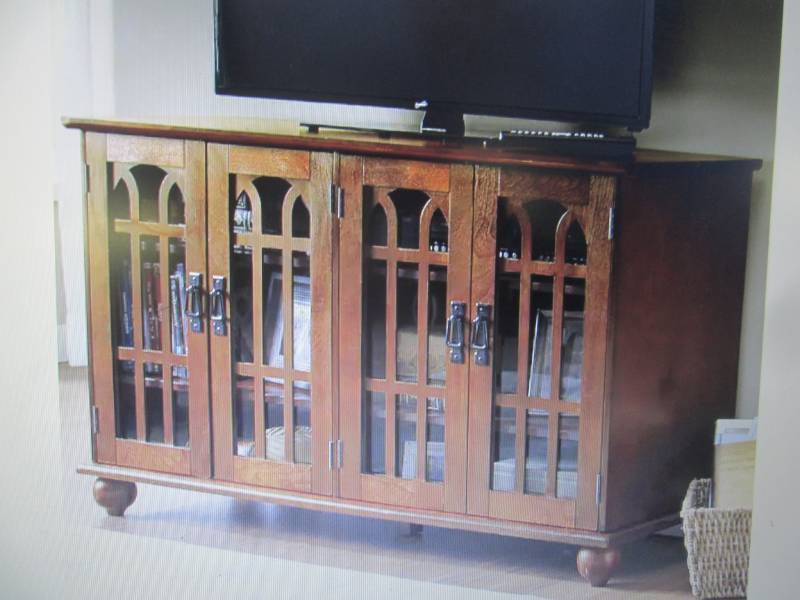 lot 32 image: Arched-Door Mission Style 4-Door TV...