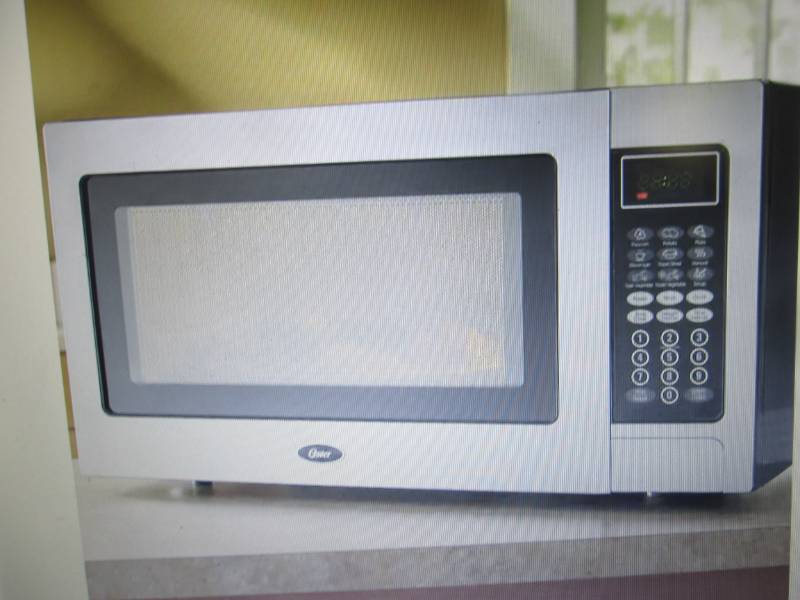 lot 134 image: Stainless Steel 1.1 Cu. Ft. Microwa...