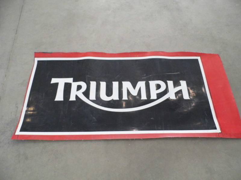 Triumph Sign Face
