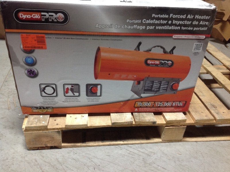 lot 102 image: Dyna-Glo Pro 125K BTU Forced Air LP Gas Portable Heater used in working conditions
