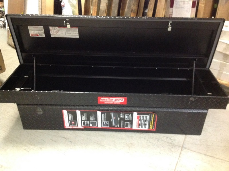 lot 103 image: Weather Guard Defender Series 71 in. x 19 in. x 17 in. Matte Black Aluminum Full Size Saddle Truck Box in good conditions