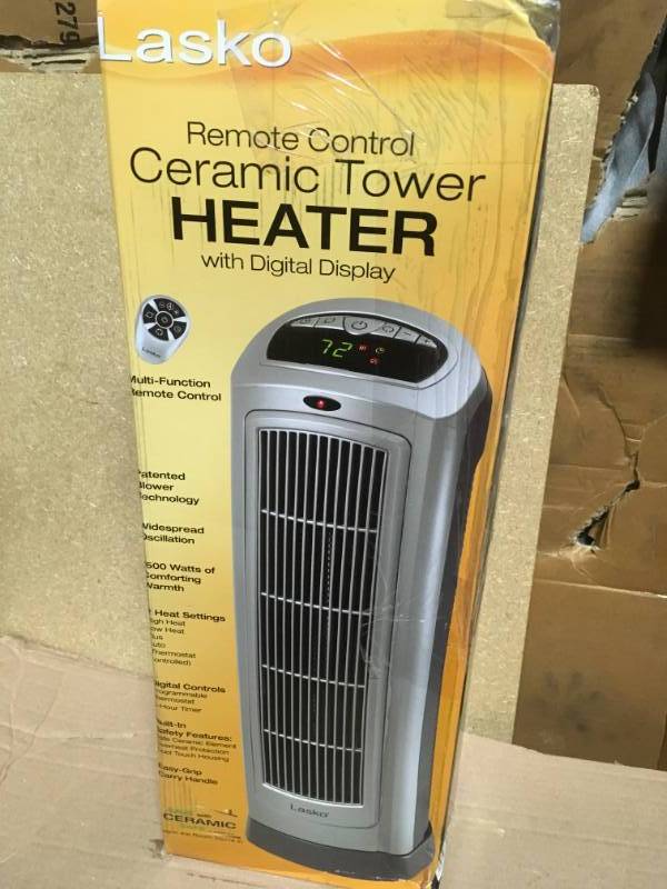 lot 38 image: Lasko 23 in. 1500-Watt Ceramic Tower Heater with Digital Display no remoter in like new condition