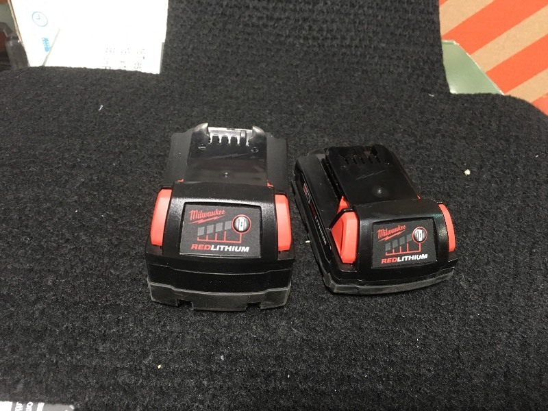 lot 106 image: Set of 1 Milwaukee M18 18-Volt Lithium-Ion XC Extended Capacity Battery 5.0Ah and 1 Milwaukee M18 18-Volt Lithium-Ion Compact Battery 1.5Ah in working conditions