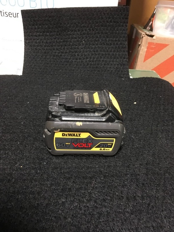 lot 105 image: DEWALT FLEXVOLT 20-Volt60-Volt MAX Lithium-Ion Battery used in working conditions