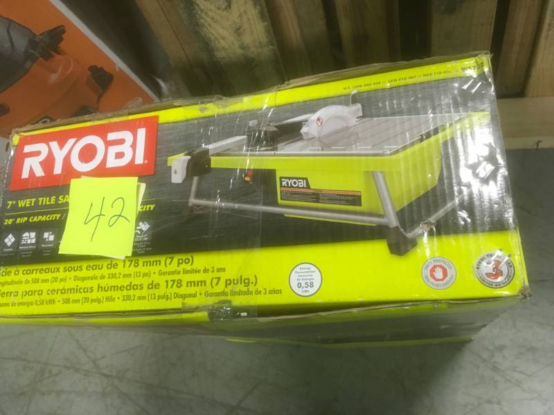 lot 42 image: RYOBI 7 in. 4.8 Amp Tabletop Tile Saw in god condition