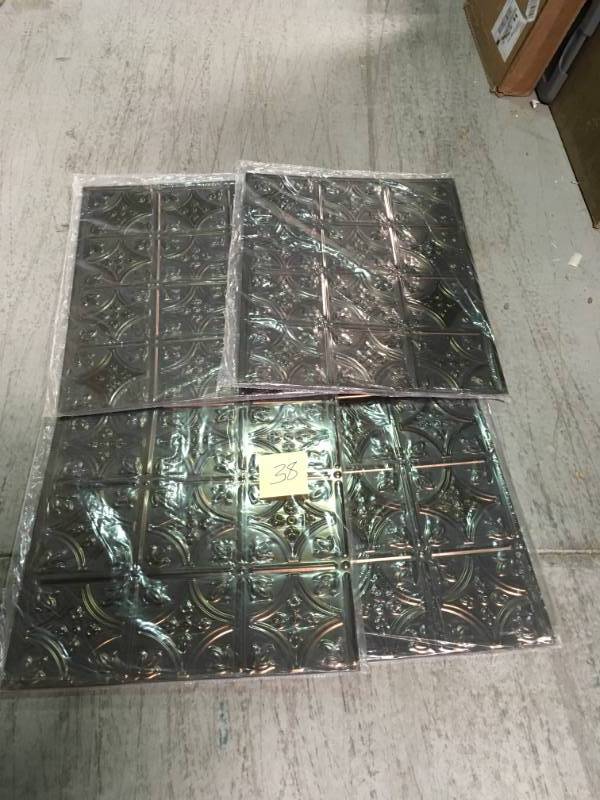 lot 38 image: Fasade 18 in. x 24 in. Traditional 1 PVC Decorative Backsplash Panel in Crosshatch Silver QTY 4  in like new condition
