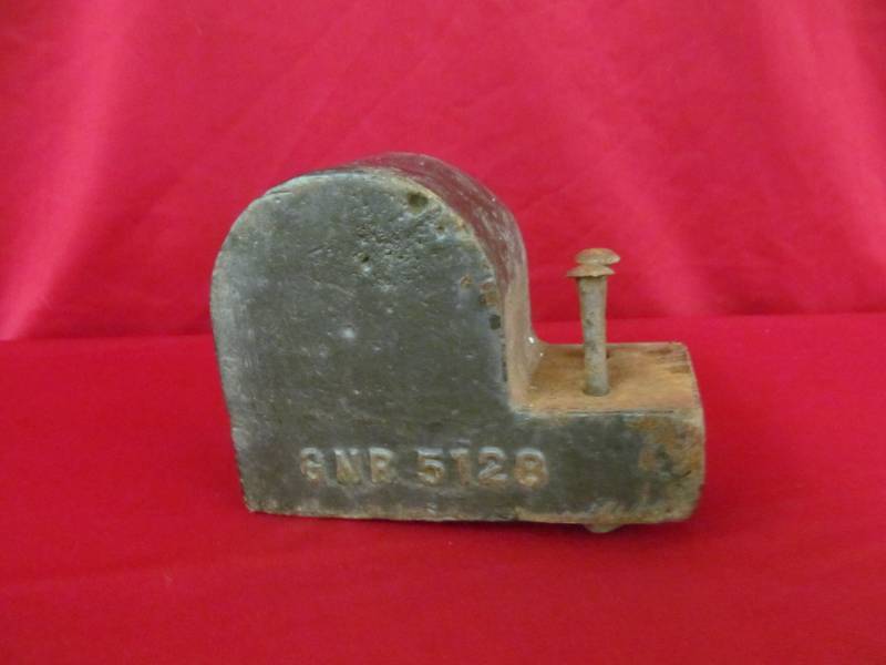 lot 7 image: cast iron railroad weight