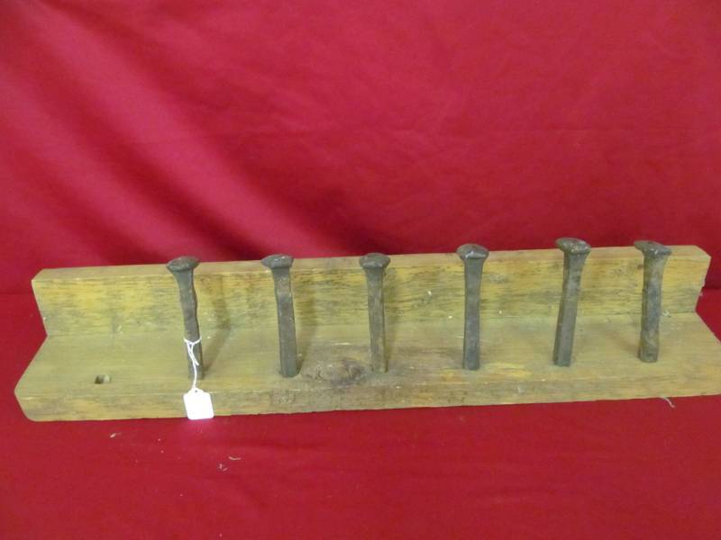 lot 74 image: railroad spike coat rack