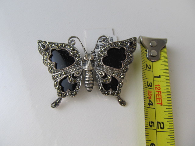 lot 106 image: Sterling Silver Onyx & Marcasite Butterfly Brooch