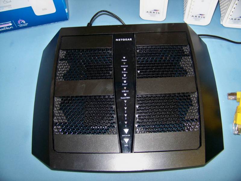 lot 67 image: (4) Motorola  Arris, SURFboard Modems, (2) Linksys, Wi-Fi Range Extenders and (1) Netgear, Nighthawk x6 Tri-Band Wi-Fi Router