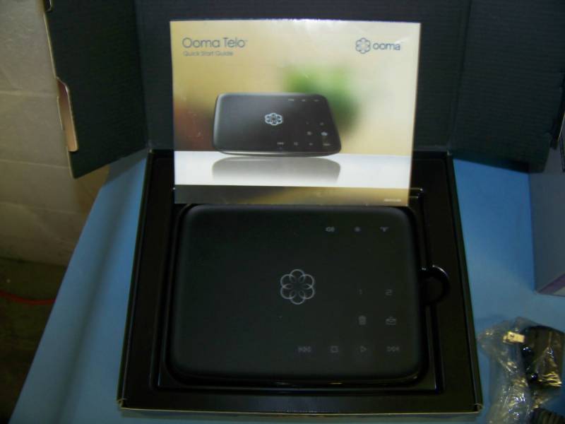 lot 68 image: Ooma Telo Phone Service Unit, Panasonic Phone  Answering System and (2) Vtech Cordless Telephones  Phones
