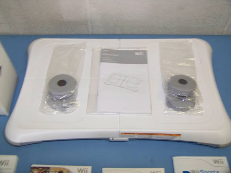 lot 69 image: Nintendo Wii Fit Exercise  Fit Board, Wii Controller and various Wii Games