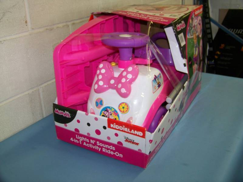 lot 115 image: KiddieLand, Minnie Mouse (Disney), Lights and Sounds 4-in-1 Activity Ride-On Cart in Original Box