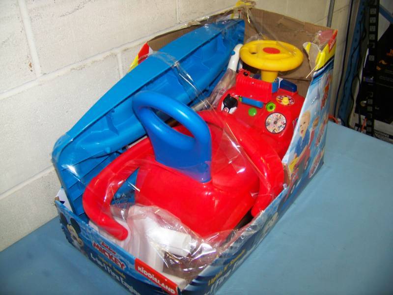 lot 116 image: KiddieLand, Minnie Mouse (Disney), Lights and Sounds 4-in-1 Fire Engine Ride-On Cart in Original Box