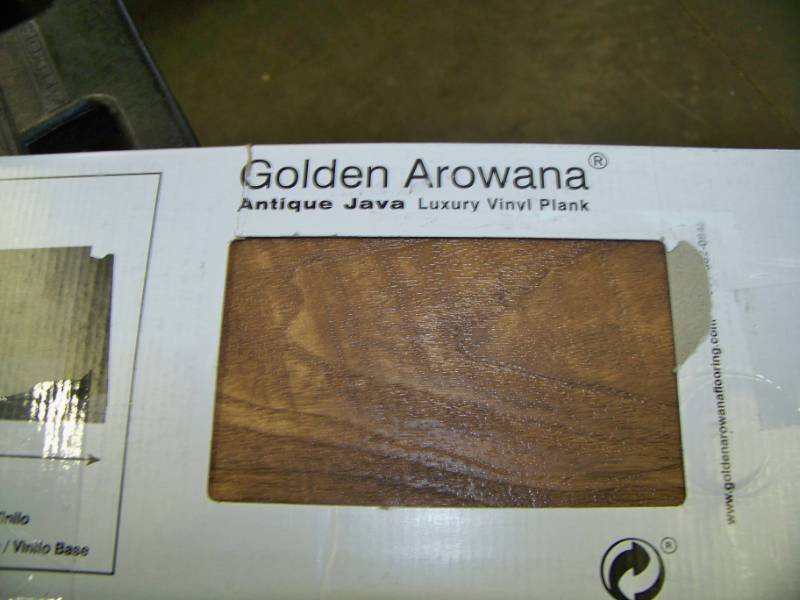 lot 94 image: (1 Box) Golden Arowana, Antique Java, Luxury Vinyl Plank  Flooring - NEW in Original Box