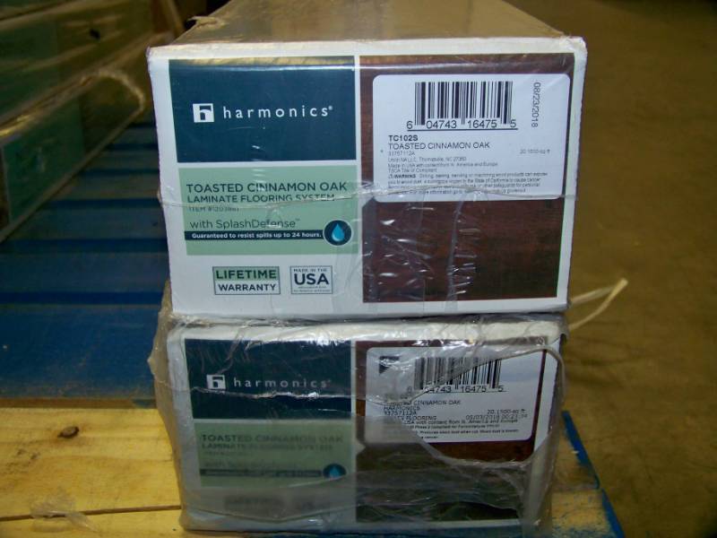 lot 96 image: (2 Boxes) harmonics, Toasted Cinnamon Oak, Laminate Flooring with Splash Defense - NEW in Original, Sealed Boxes