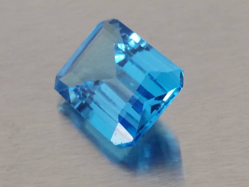 lot 62 image: 10.13 CT Natural Blue Topaz Emerald Octagon Cut Gem