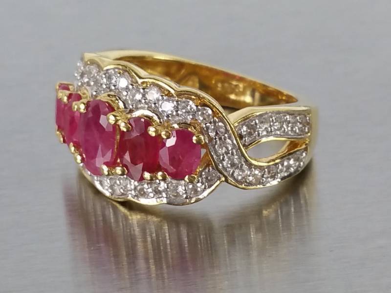 lot 87 image: Ruby and Diamond Estate Ring in Sterling Silver