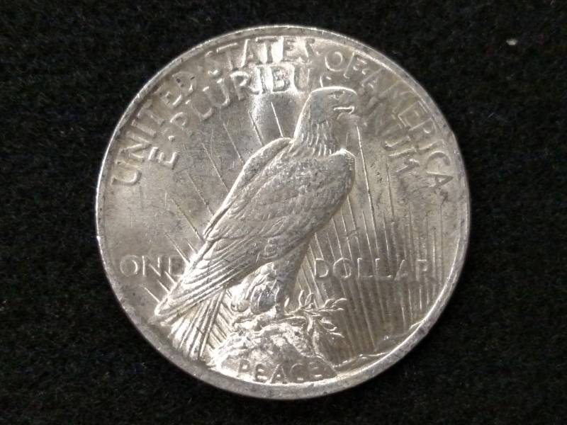 lot 24 image: 1922 Peace Silver Dollar...