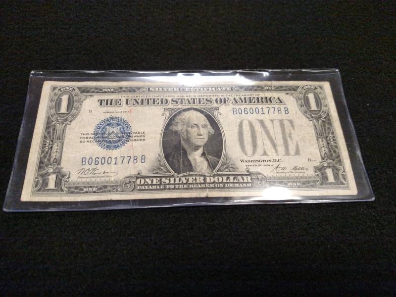 lot 113 image: 1928 A Funny Back One Dollar Silver...