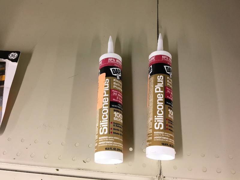 lot 486 image: Two DAP 10.8 oz. Silicone Plus Premium Rubber Kitchen and Bath Sealant, Retail $11.99