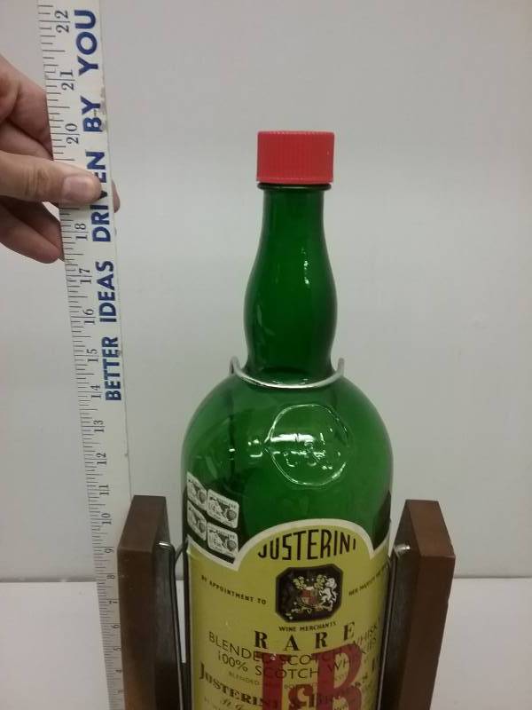 lot 69 image: Rare Justerini J & B Scotch Whisky 1 Gal Rotating Bottle