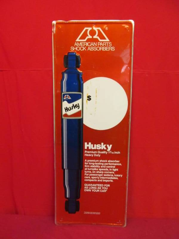 lot 227 image: Husky Shock Absorber tin sign