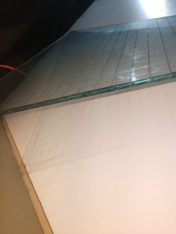 lot 13 image: Triangular Pane of Glass w Grid Pattern