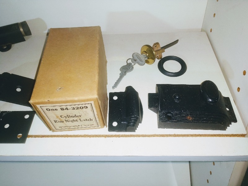 lot 34 image: Orange Sierra Electric and Manufacturing Company Box - Tacks - Screws - Bolts - Stanley Hinges - Door Stops - Cylinder Rim Night Latch - Lock and Key